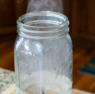 Glass jar with white smoke 